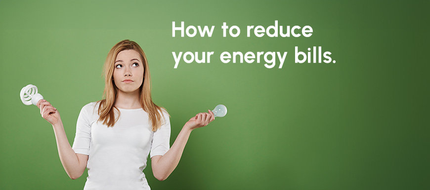 Woman holding lightbulbs with a quizzical look on her face